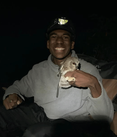 Jayshaun Talbert with Saw-whet Owl